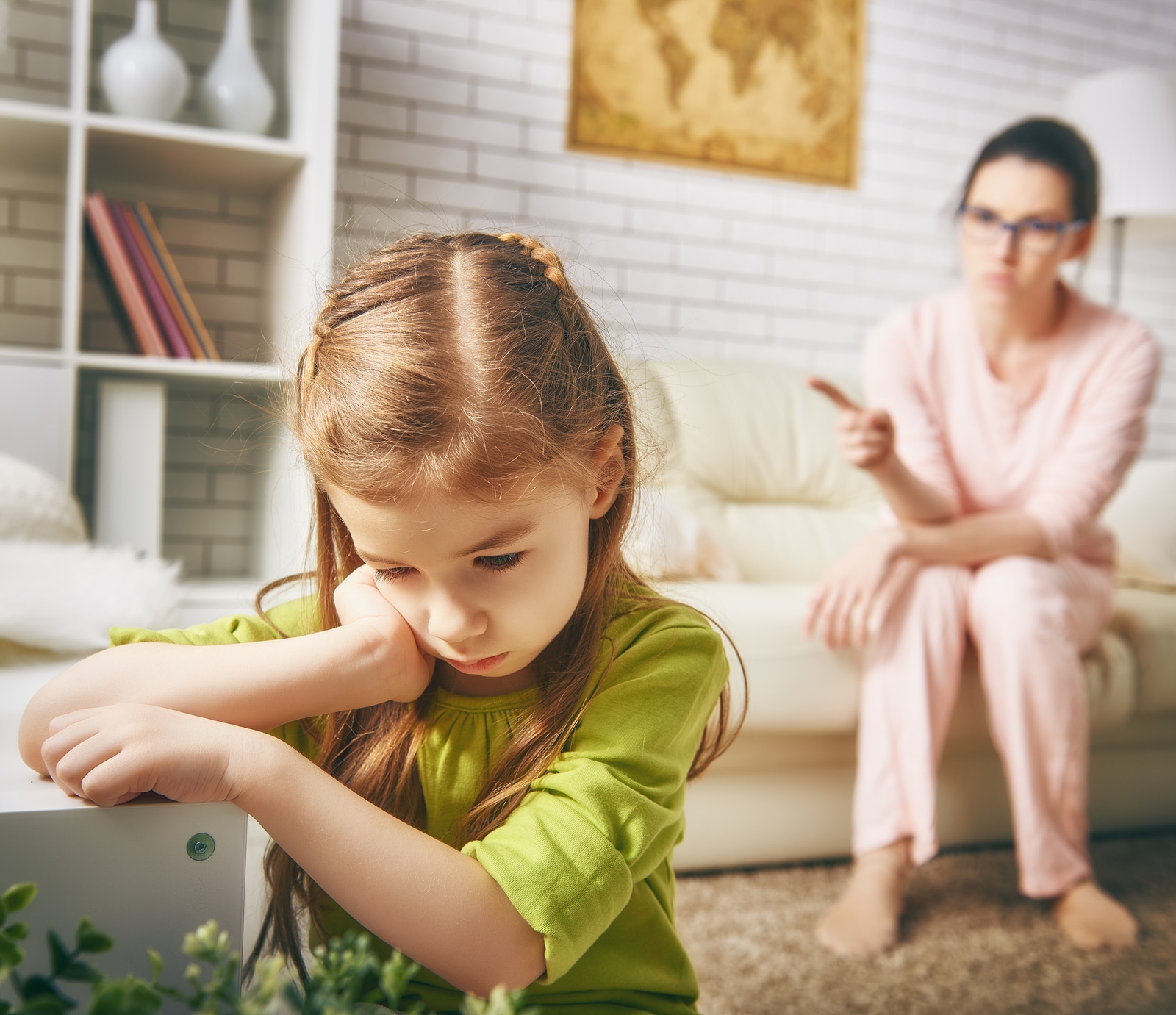 the education of the child. mother scolds her child girl. family