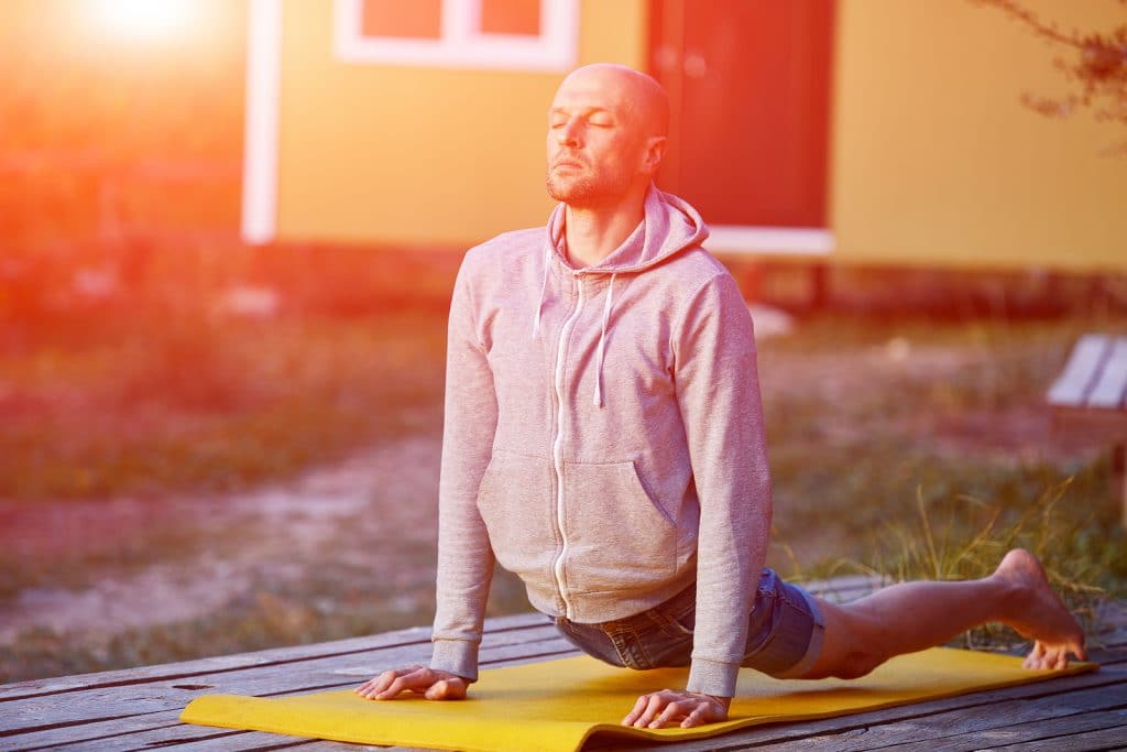 young man doing yoga