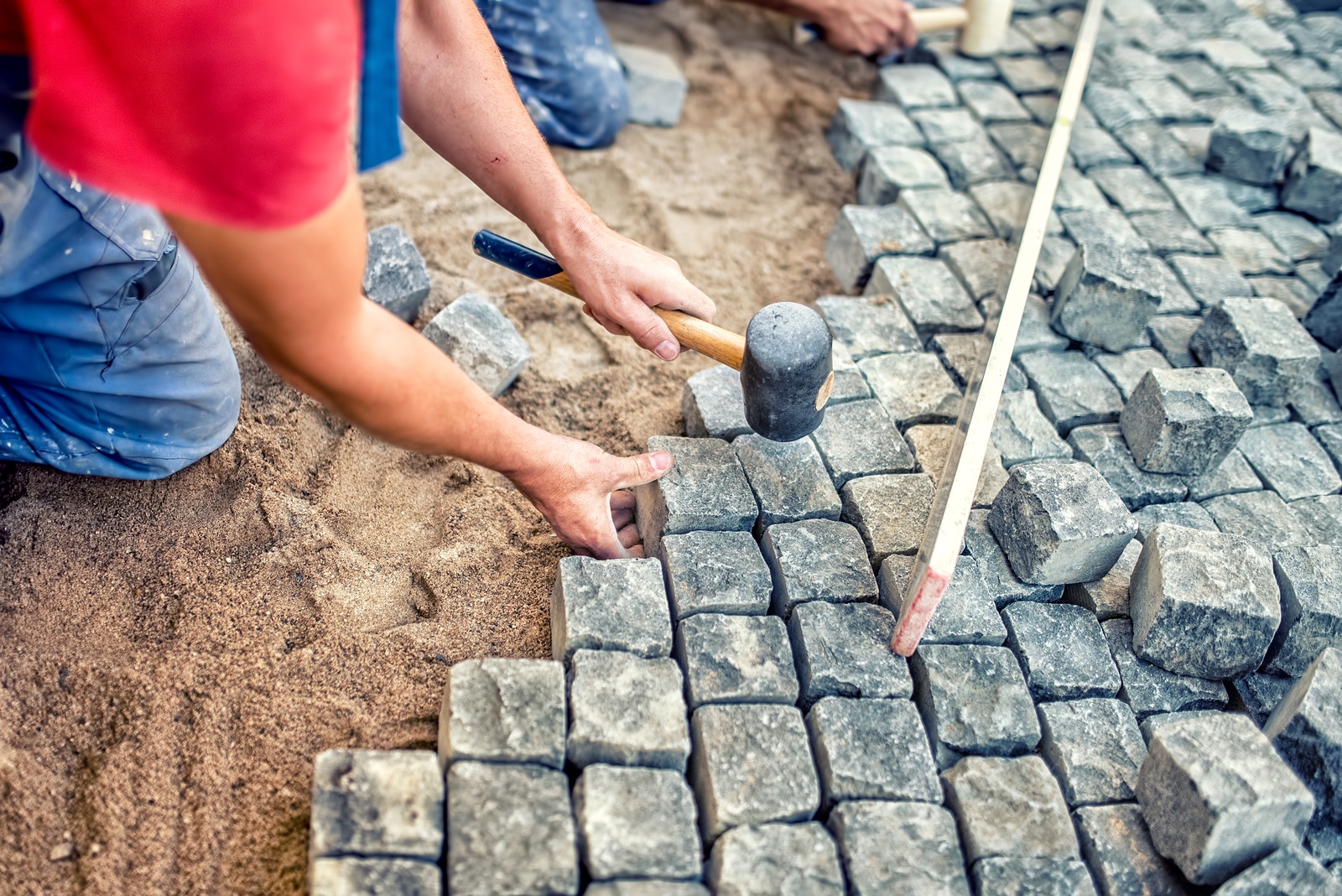 Paving Pavement With Granite Stones, Workers Using Industrial Co