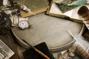 Vintage composition with books and pocket clock