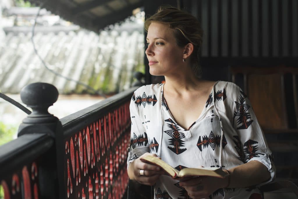 Young Woman Reading Book