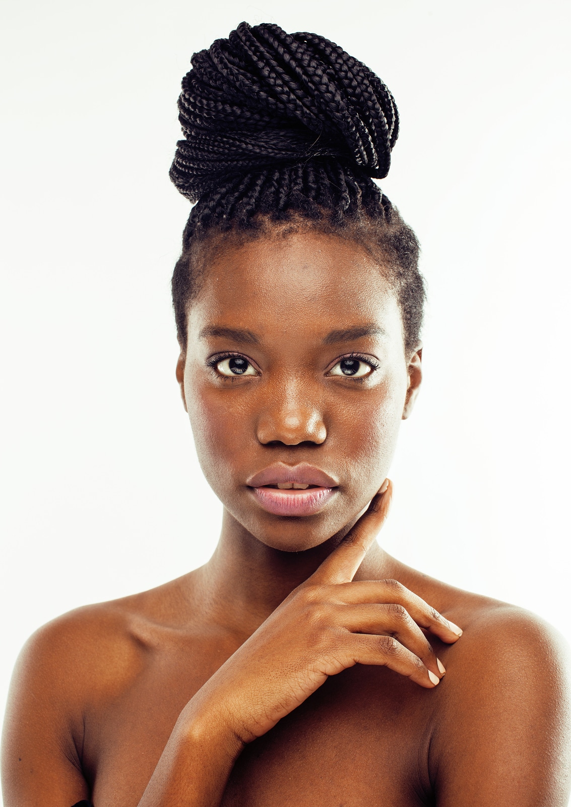 young pretty african american woman naked taking care of her skin isolated on white background, healthcare people concept close up