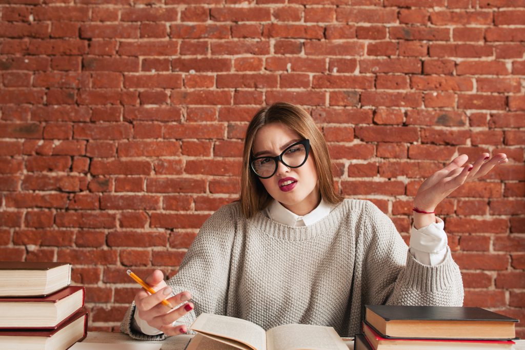 Student girl dont know answer free space. Portrait of young woman cannot get necessary material. Stupid girl, ignorance, laziness concept