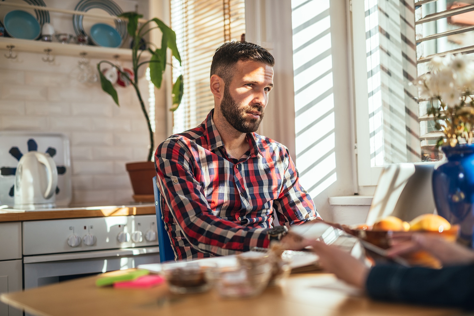 Handsome casual man working on a computer at home.