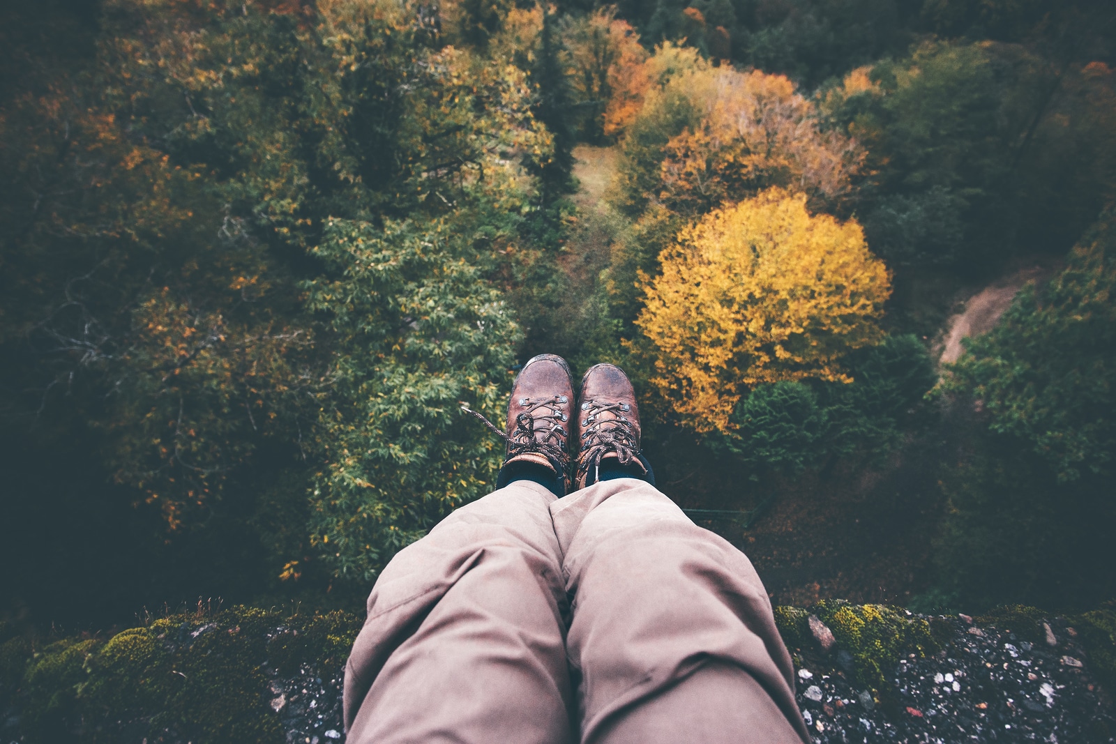 Feet selfie on cliff with forest aerial view Travel Lifestyle adventure vacations concept into the wild