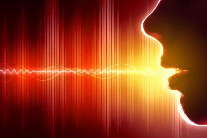 Ilustração de onda sonora saindo da boca de uma pessoa.