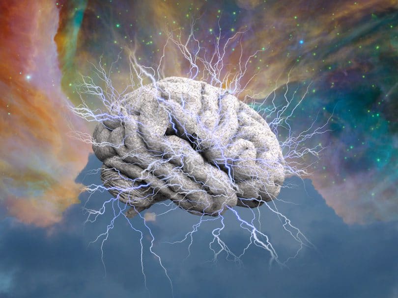 Ilustração de um cérebro emanando raios de energia sobre fundo colorido.