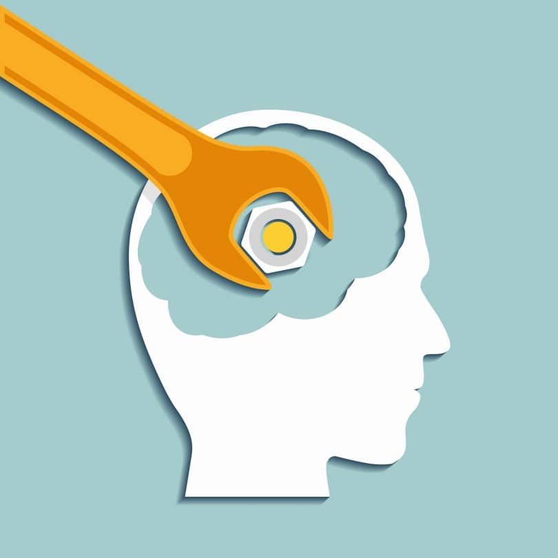 Ilustração de cabeça humana com uma chave inglesa apertando um parafuso dentro do cérebro.