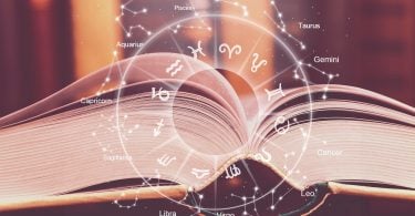 Livro aberto com símbolos dos signos