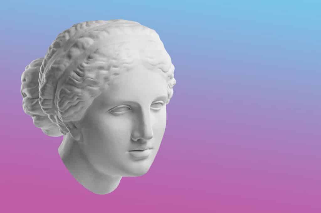 Imagem de fundo rosa e azul do rosto da deusa Afrodite.
