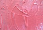 Fundo de uma parede feita em textura cor de rosa.