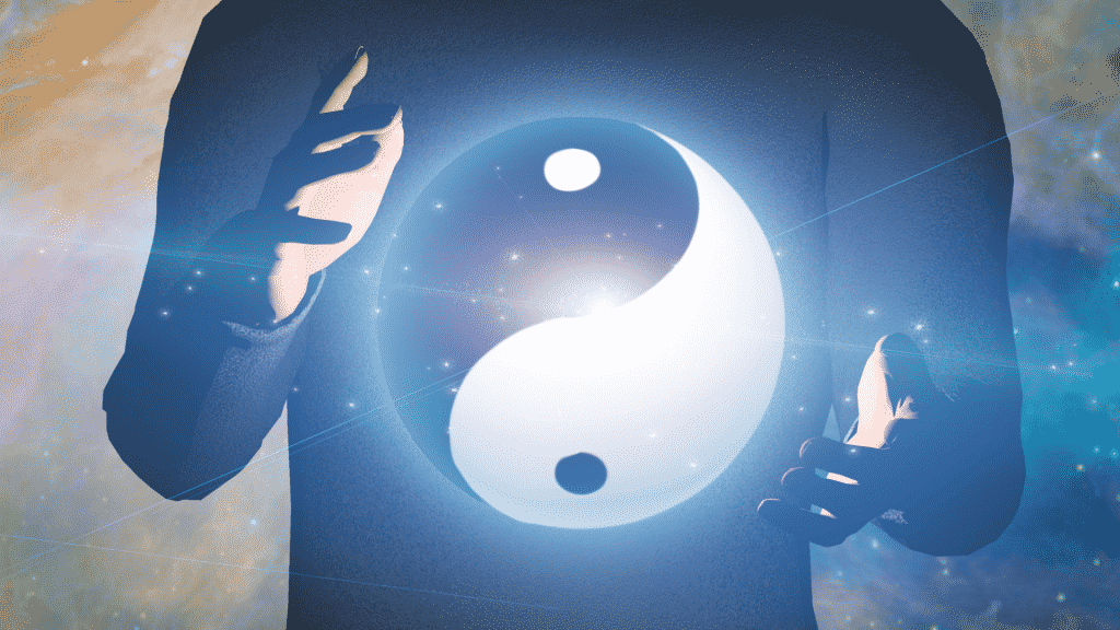 Esfera de Yin Yang com brilho azul flutuando entre as mãos de uma pessoa