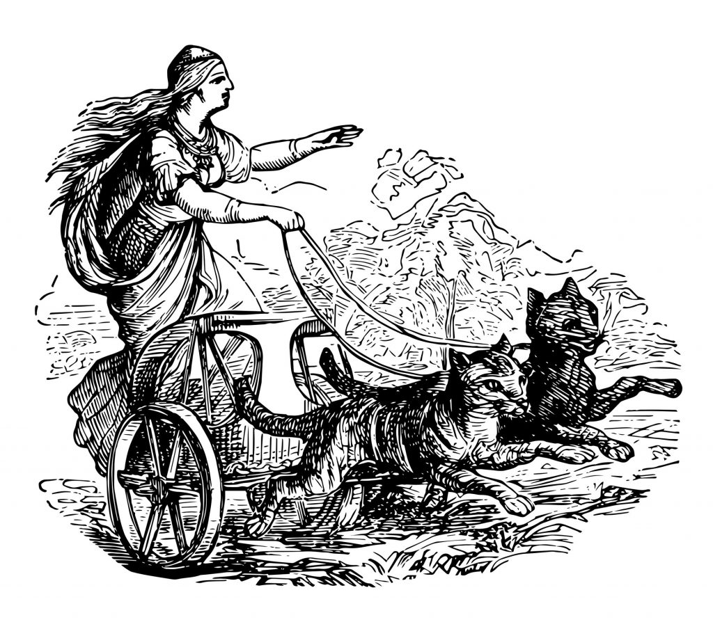 Representação da deusa Freya. Uma mulher em um carro sendo puxado por 2 gatos.