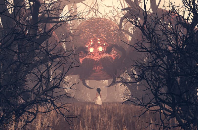 Aranha gigante diante de uma garota em meio a uma floresta.