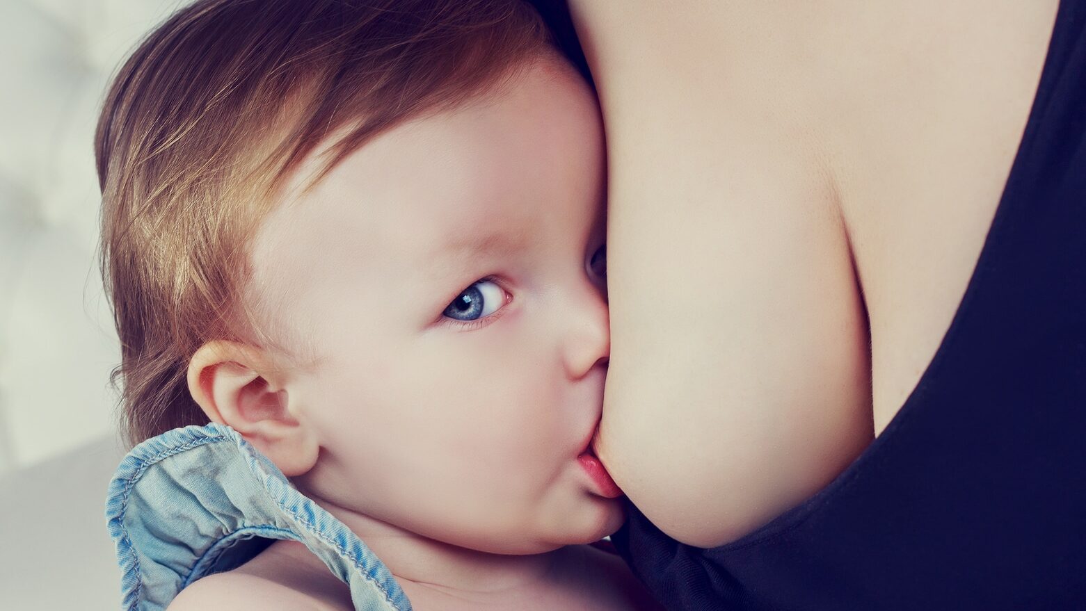 mother breastfeeding her one year old baby