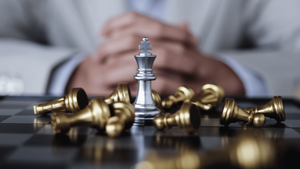 Conceito de competitividade usando como exemplo um jogo de xadrez. 