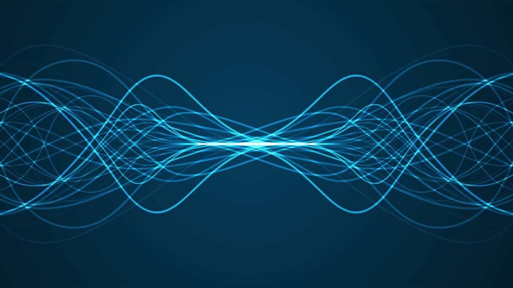 Imagem de fundo azul e em destaque, linhas de ondas sonoras em azul claro.
